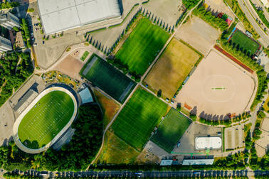 Aerial view of the sports park's fields and buildings.