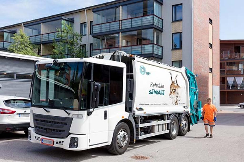 “Sähköllä kehräävä” ilves kuvittaa uutta HSY:n jäteautoa.